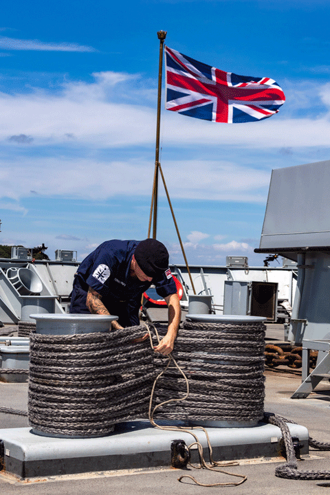 Seaman with mooring ropes