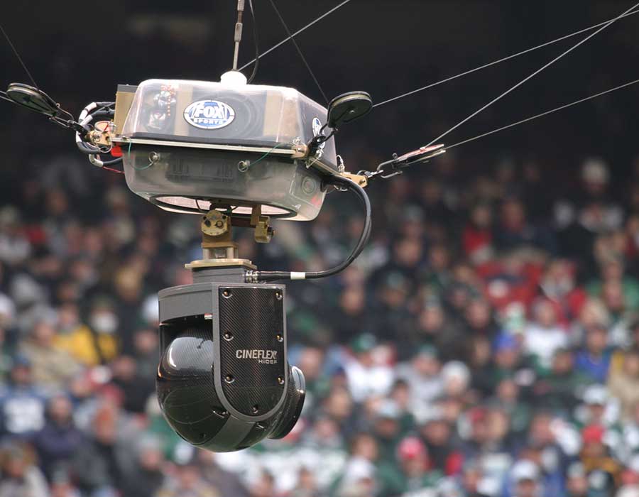 Camera rigging system using Samson Rope in an arena, ensuring stability and safety during a live event