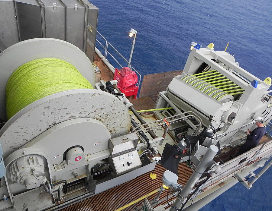 A large spool of yellow/green synthetic towing lines by Samson Rope used in offshore energy operations