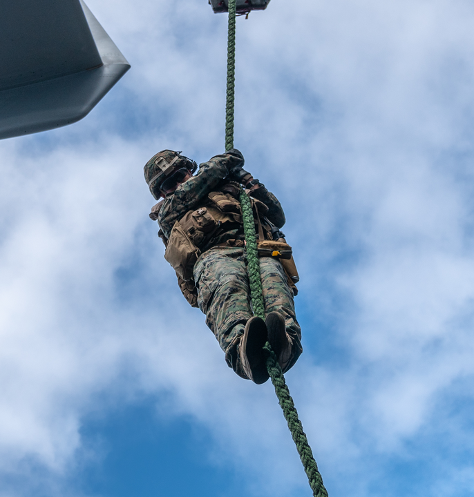 Military personnel fast roping from a helicopter with Samson Rope, built for